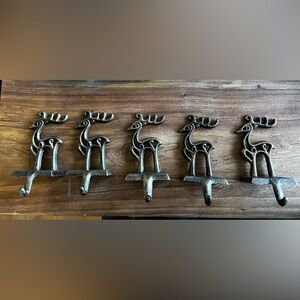 5 reindeer stocking holders for the fireplace mantel.